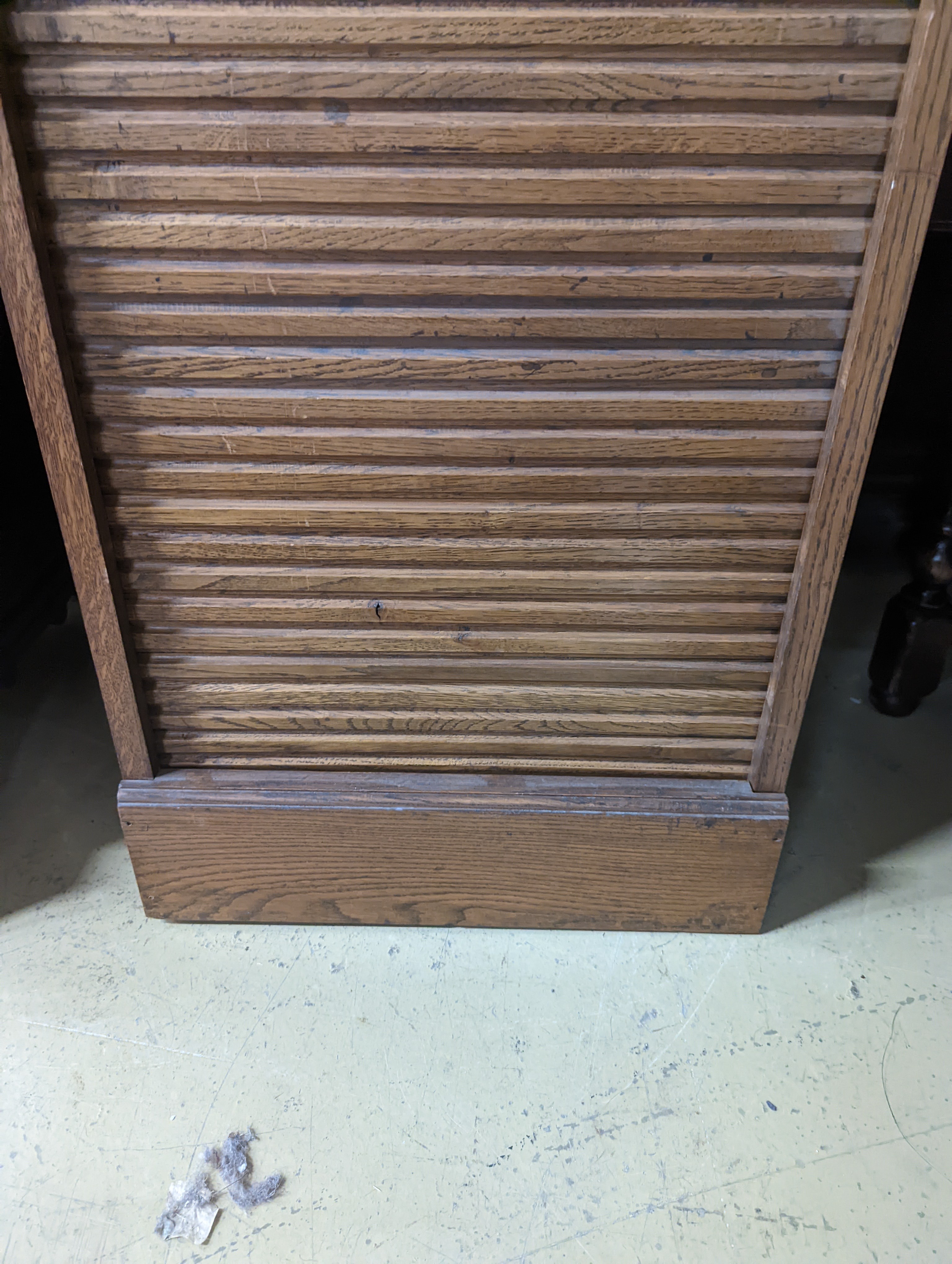 An early 20th century oak tambour filing cabinet, width 49cm, depth 40cm, height 125cm